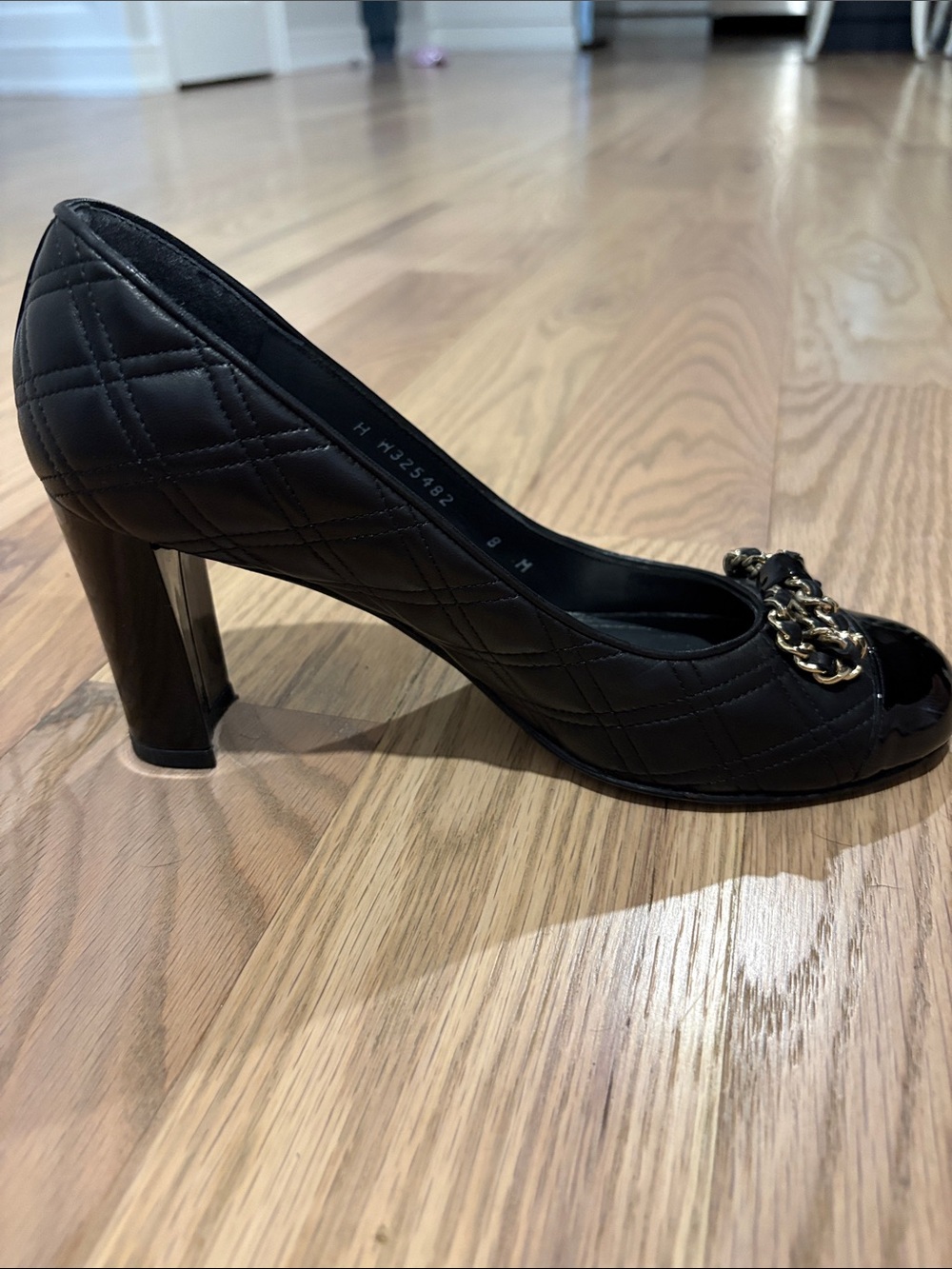 Stuart Weitzman Quantas Quilted Black Leather Pump with Gold Chain Bow